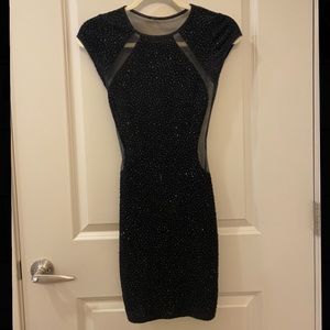 Black sparkle mini dress with mesh back and sides, fitted/stretch